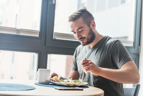 Man eating meal in a restaurant